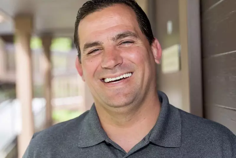 a happy patient with perfect full mouth reconstructive implants